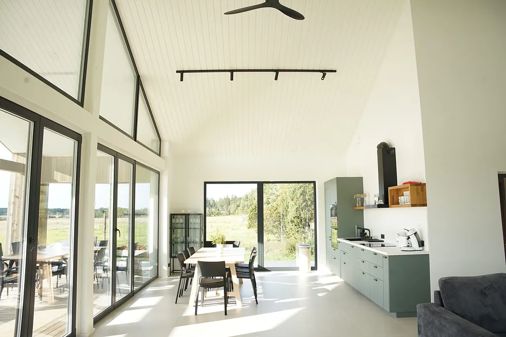 Living room and kitchen with high ceilings